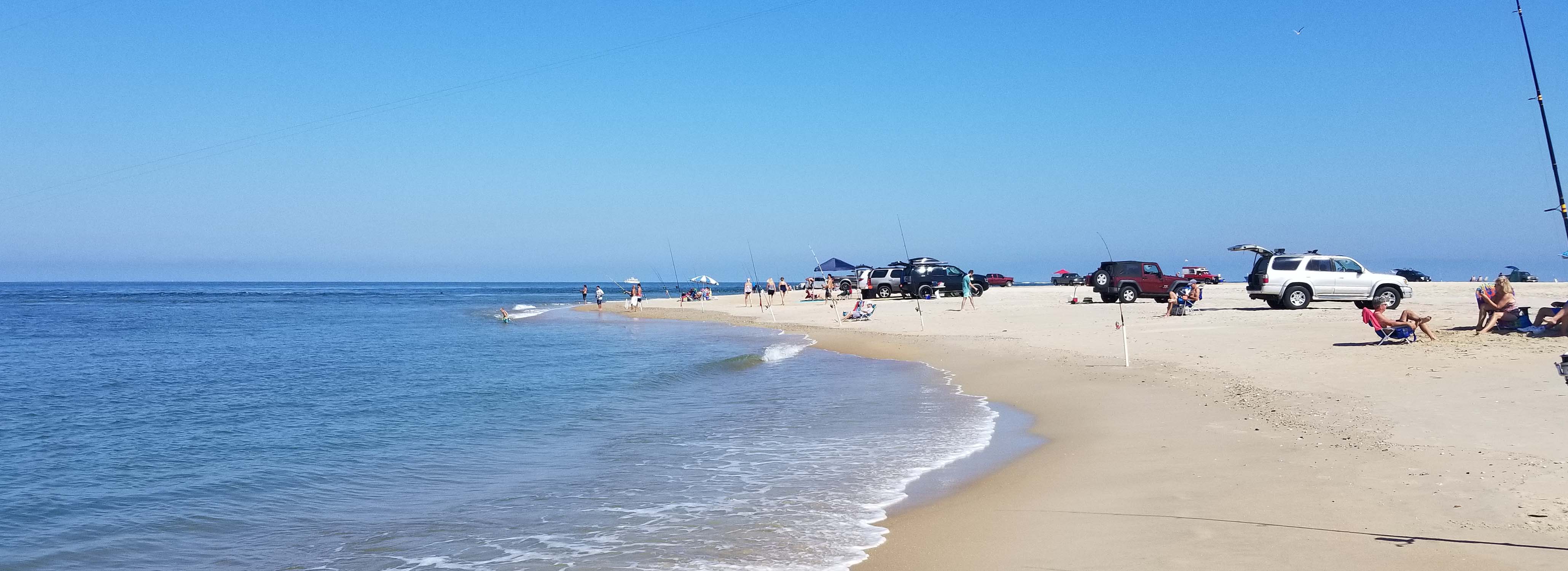 surf fishing vehicles on the beach